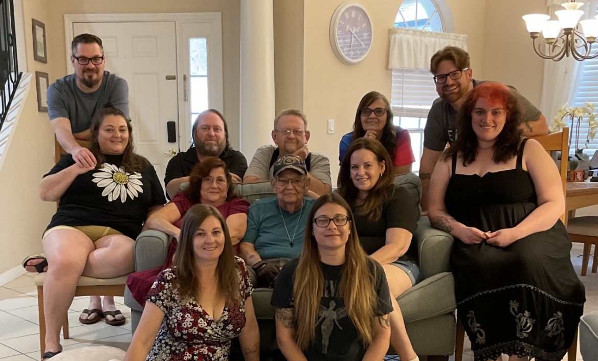 Jay surrounded by a large family group