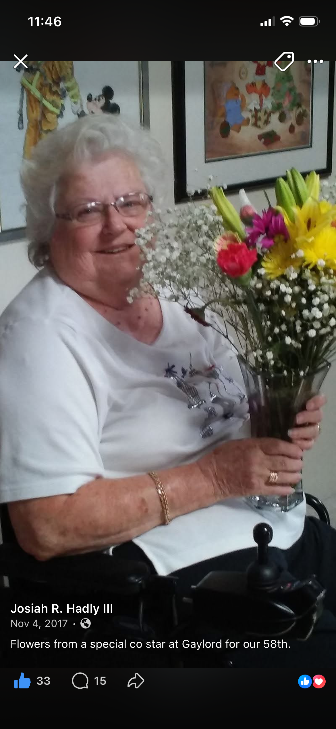 Noel holding a colorful bouquet of flowers